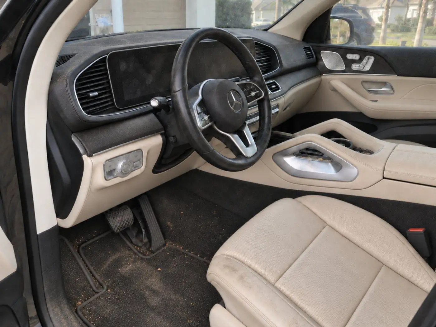 Dirty Mercedes interior with crumbs and stains before detailing